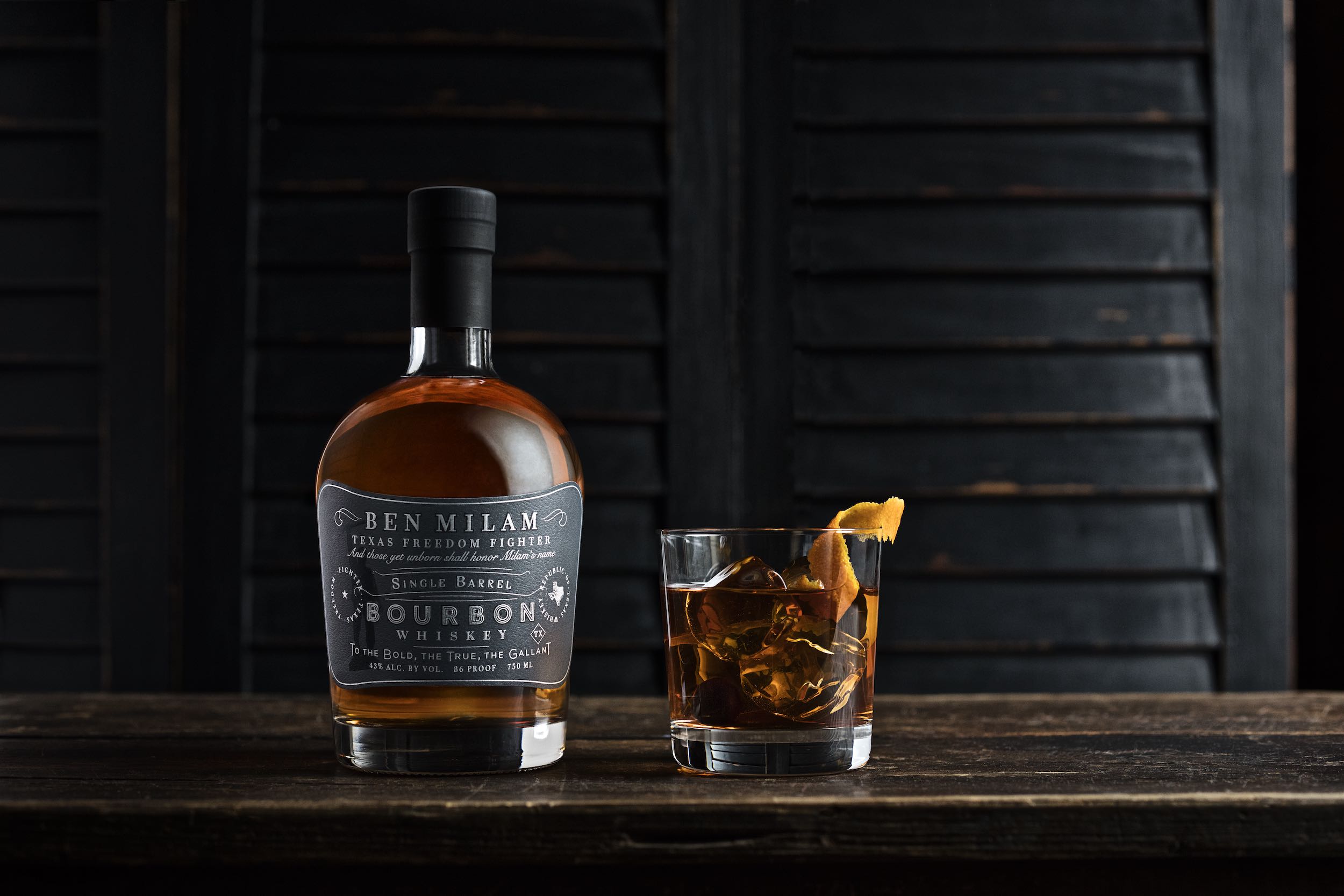 Jody Horton Photography - Ben Milam Bourbon Whiskey bottle with classic whiskey on rocks.
