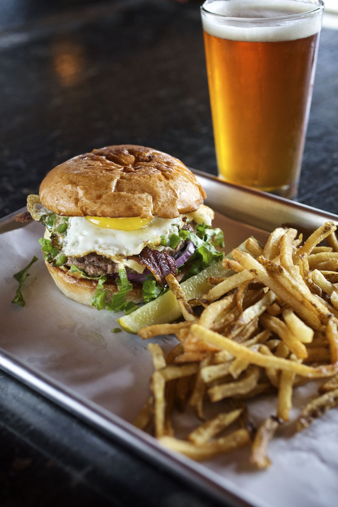 Jody Horton Photography - Burger and fries on parchment served with draft beer. 