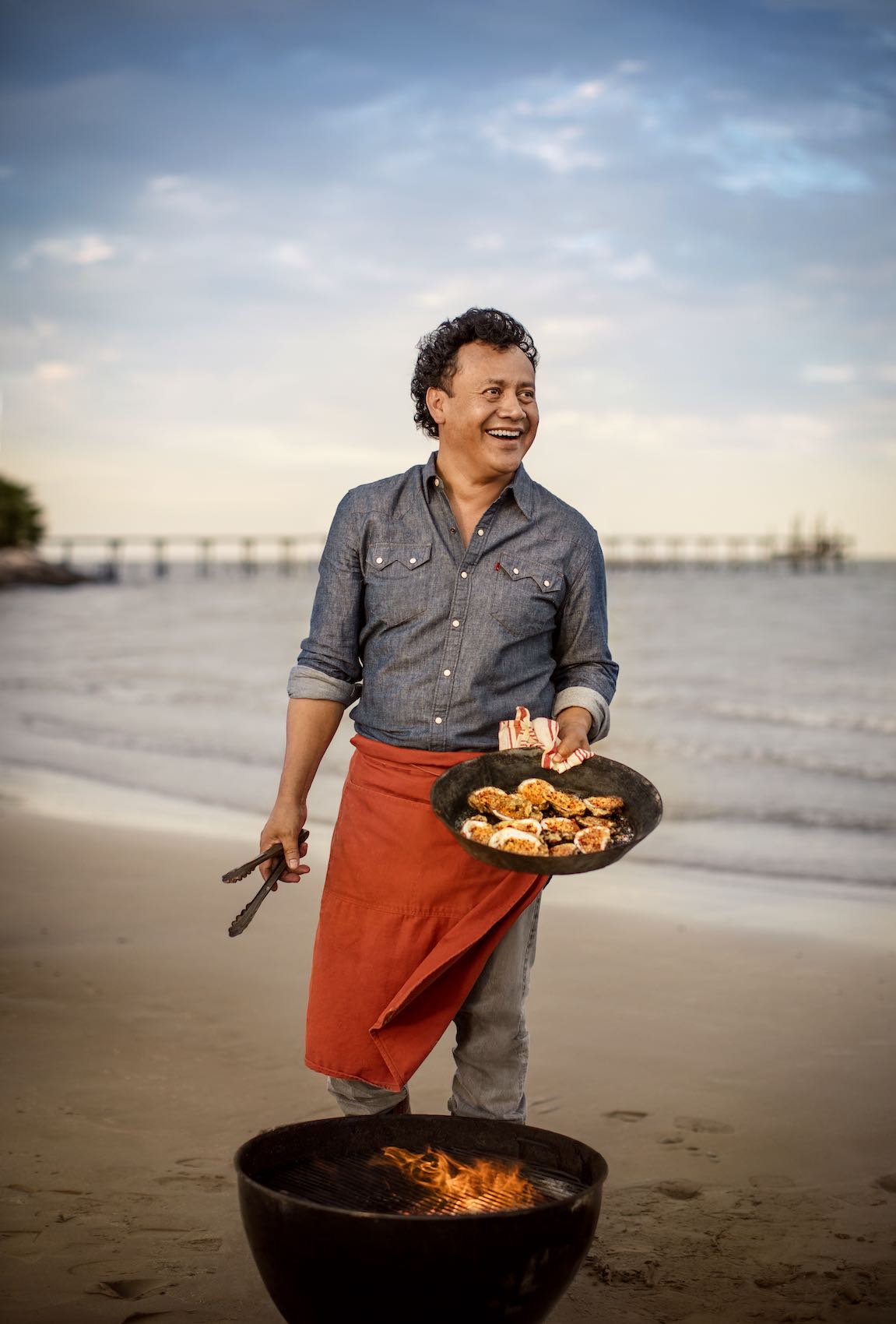 Jody Horton Photography - Chef grilling oysters on the beach. 