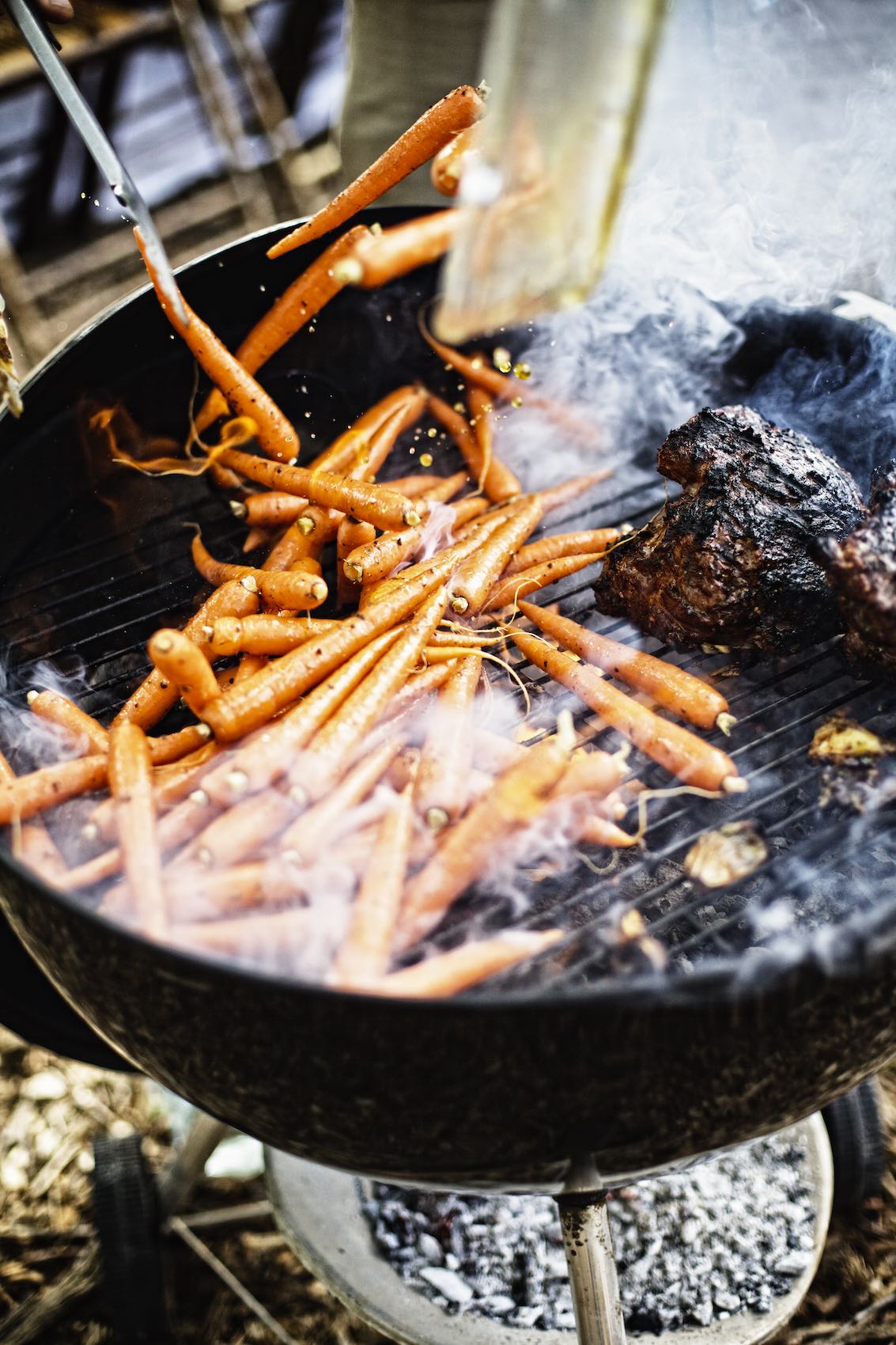 Jody Horton Photography - Carrots and meat cooking on a grill. 