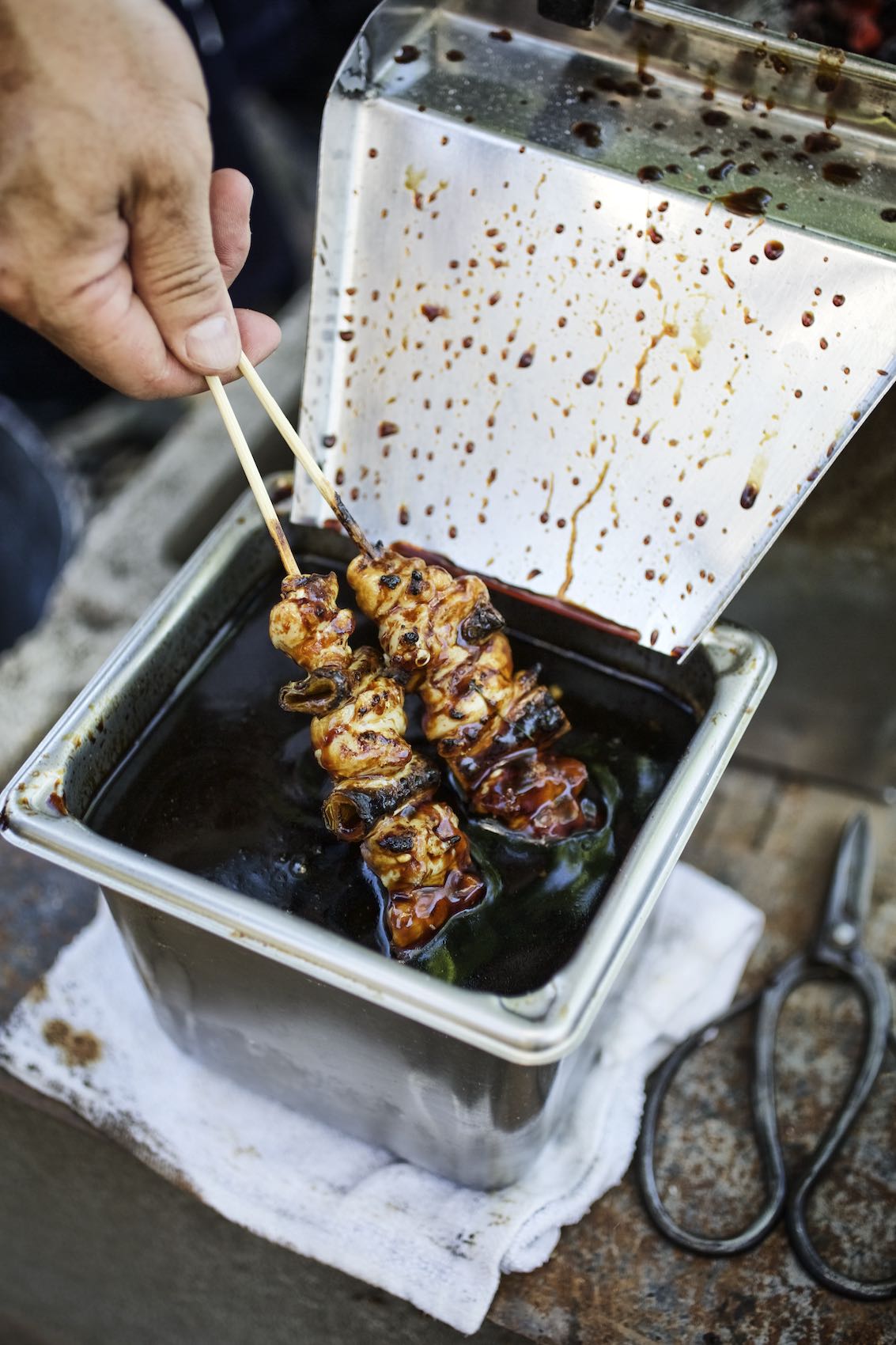 Jody Horton Photography - Kebabs dipping in seasoning sauce.