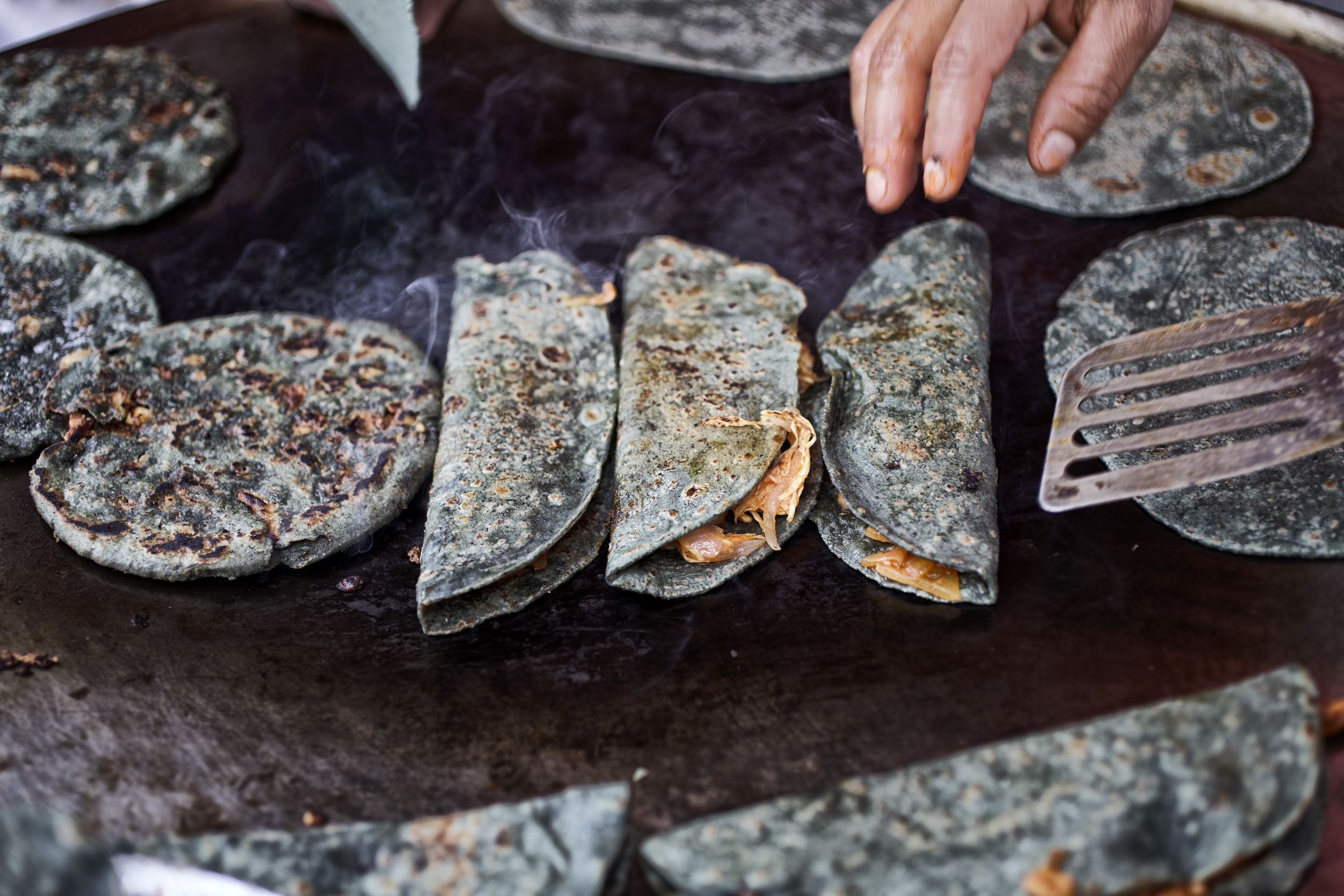 Jody Horton Photography - Cooking tacos on steaming flattop. 