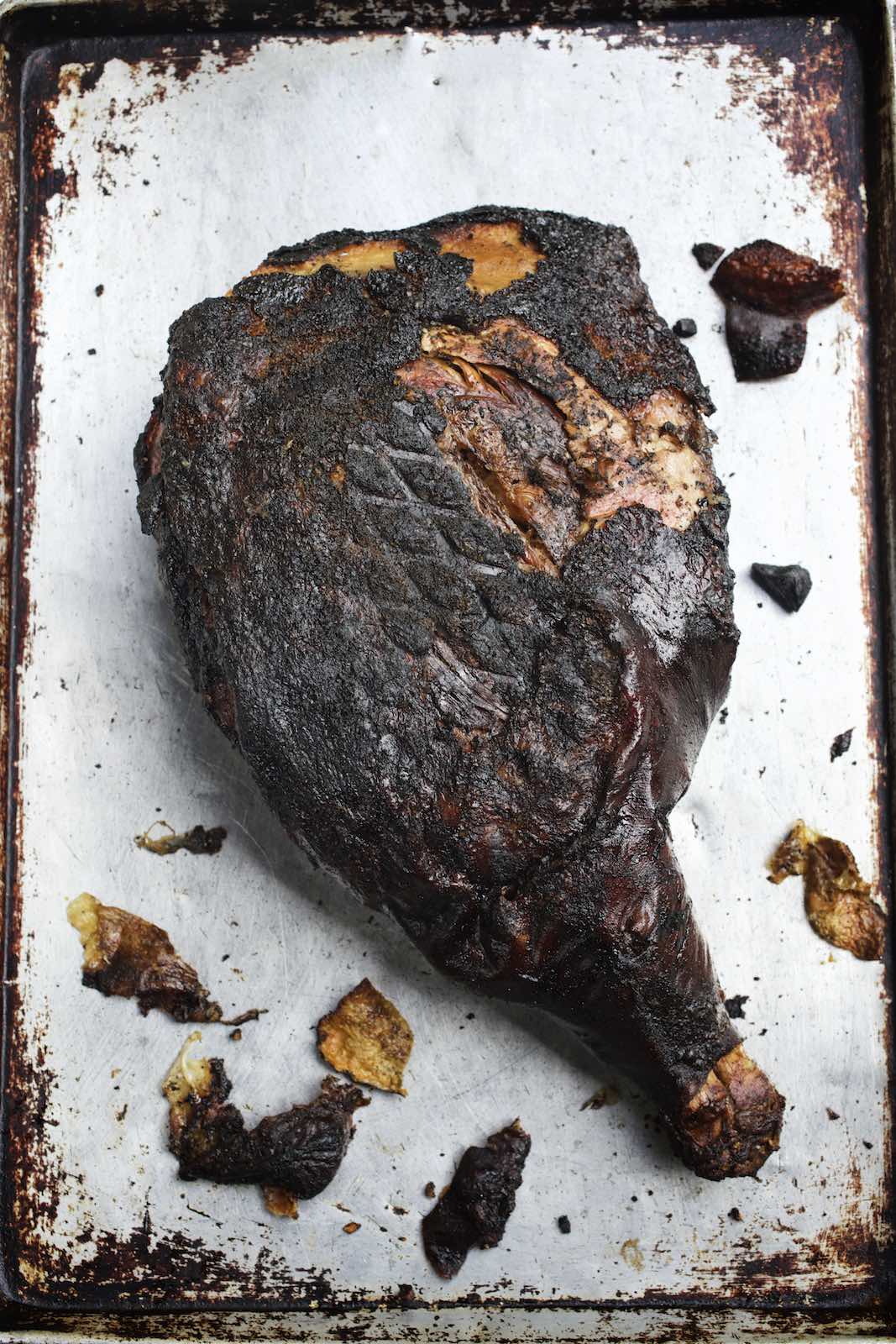 Jody Horton Photography - Charred meat on a metal sheet pan. 