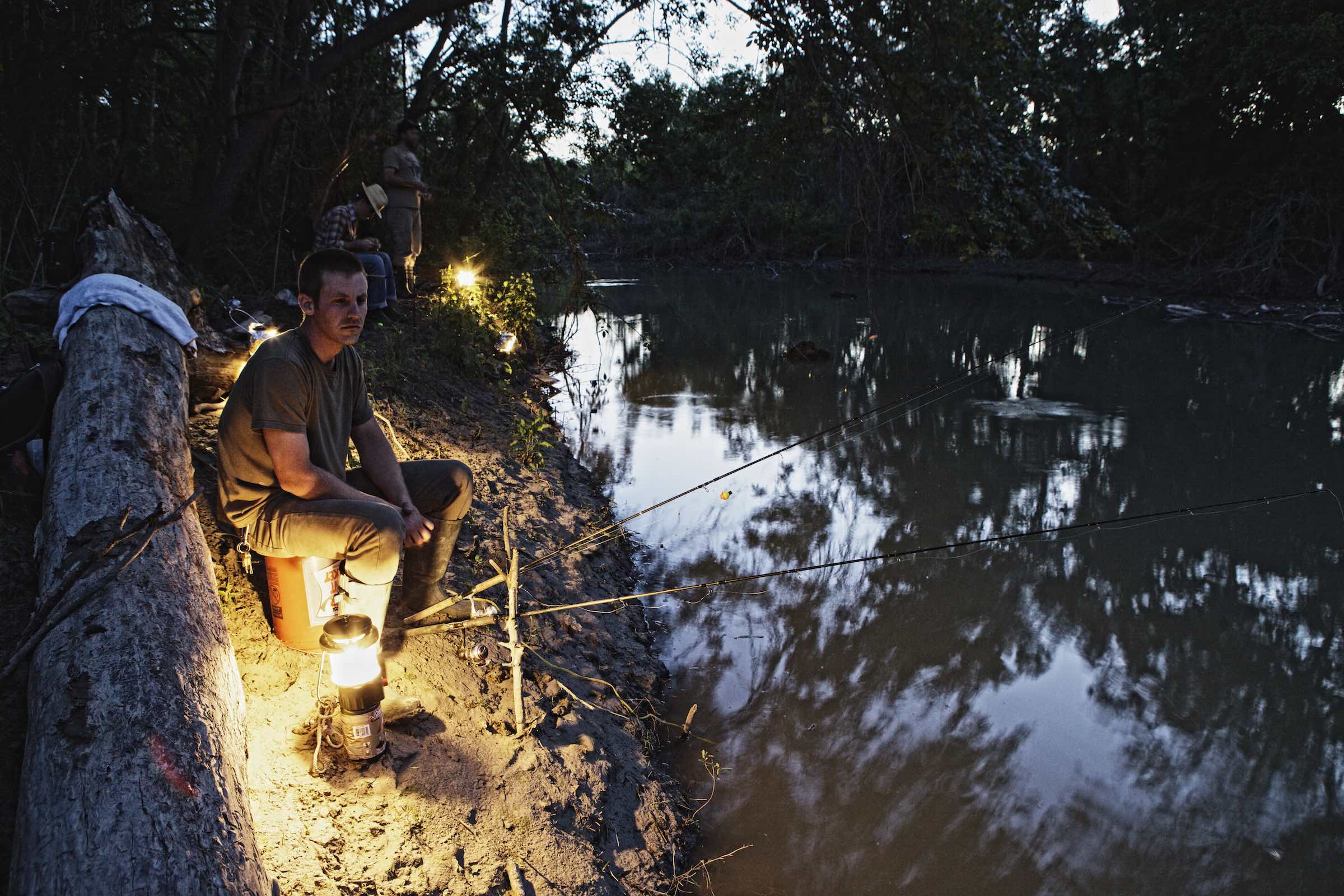 Jody Horton Photography - Fishermen waiting along the riverbank at dusk. 