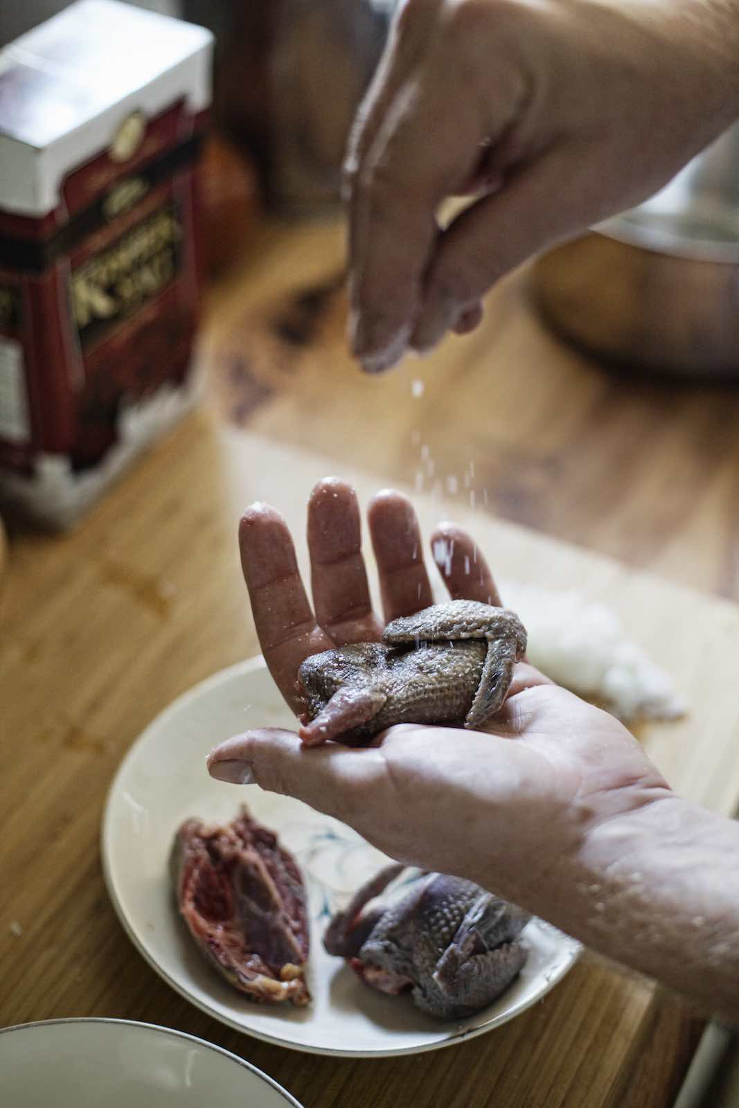 Jody Horton Photography - Chef salting the doves. 