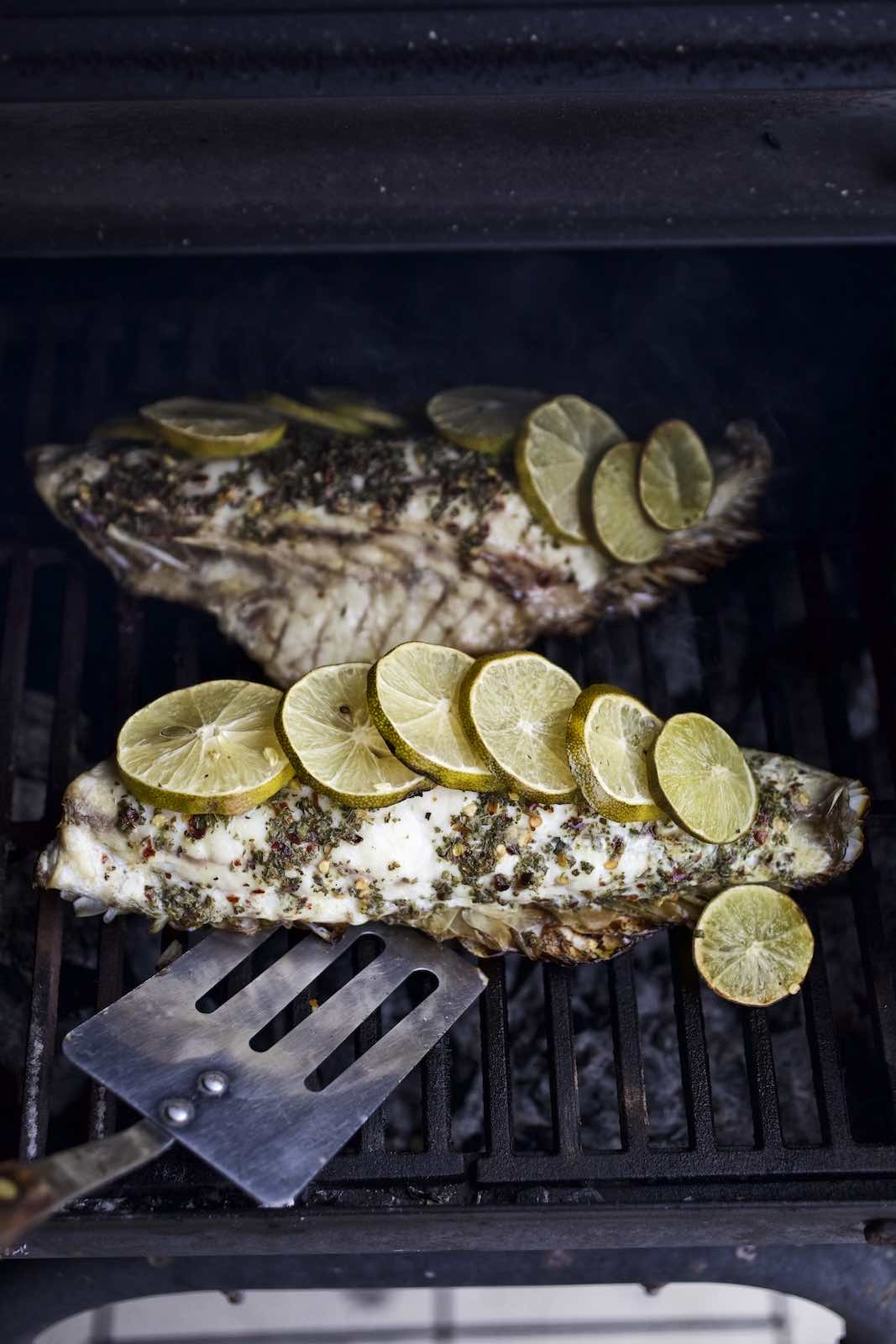 Jody Horton Photography - Fish fillets with lime slices cooking on the grill.