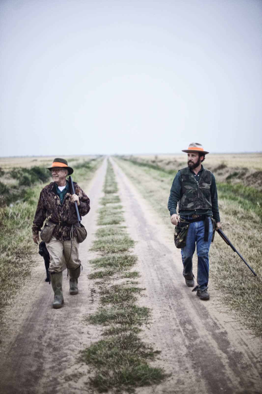 Jody Horton Photography - Hunters walking down a dirt path. 