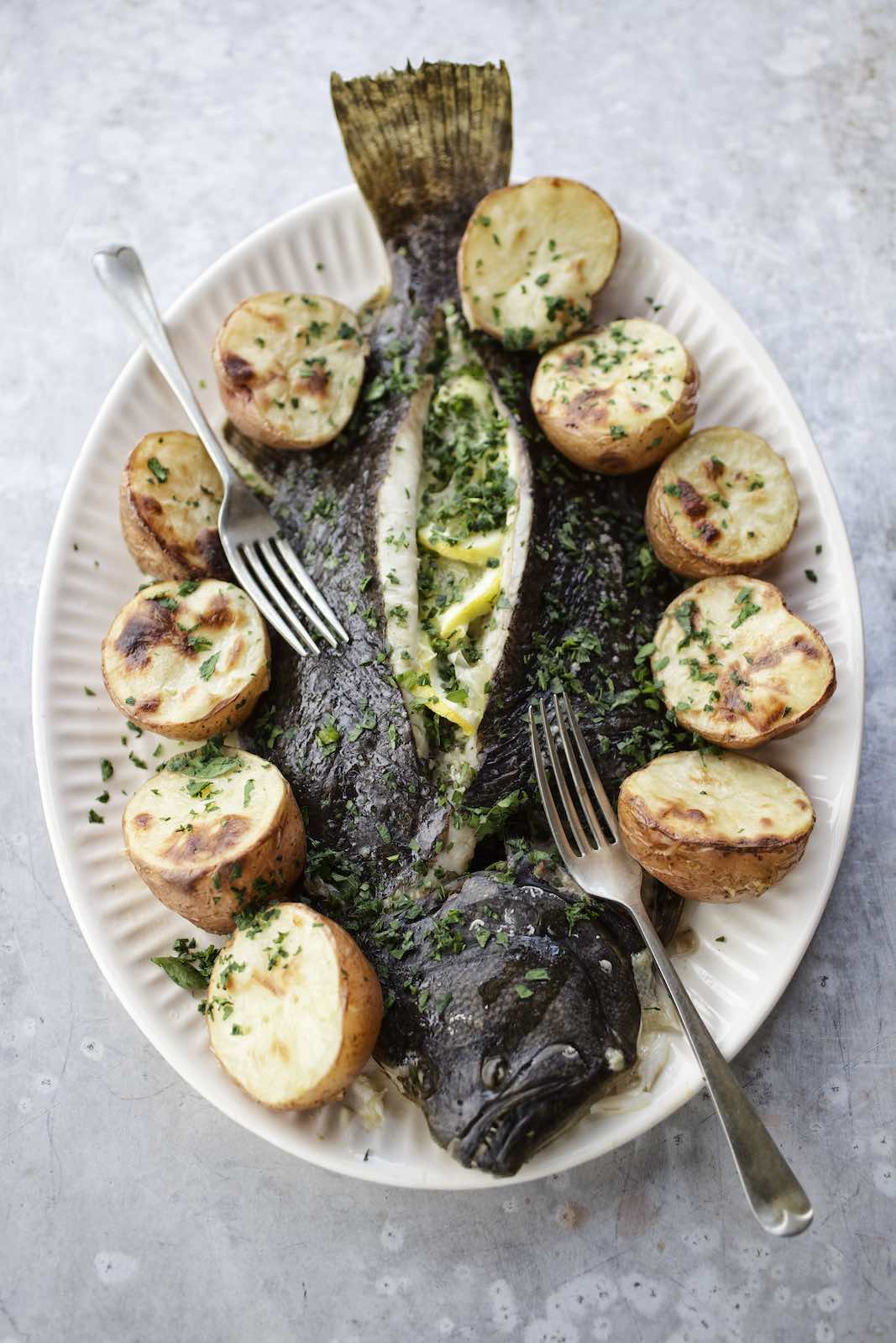 Jody Horton Photography - Cooked flounder with roasted potatoes, herbs, and lemon.