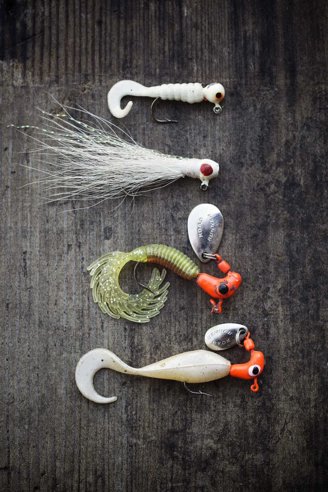 Jody Horton Photography - Fishing lures on a wood table.