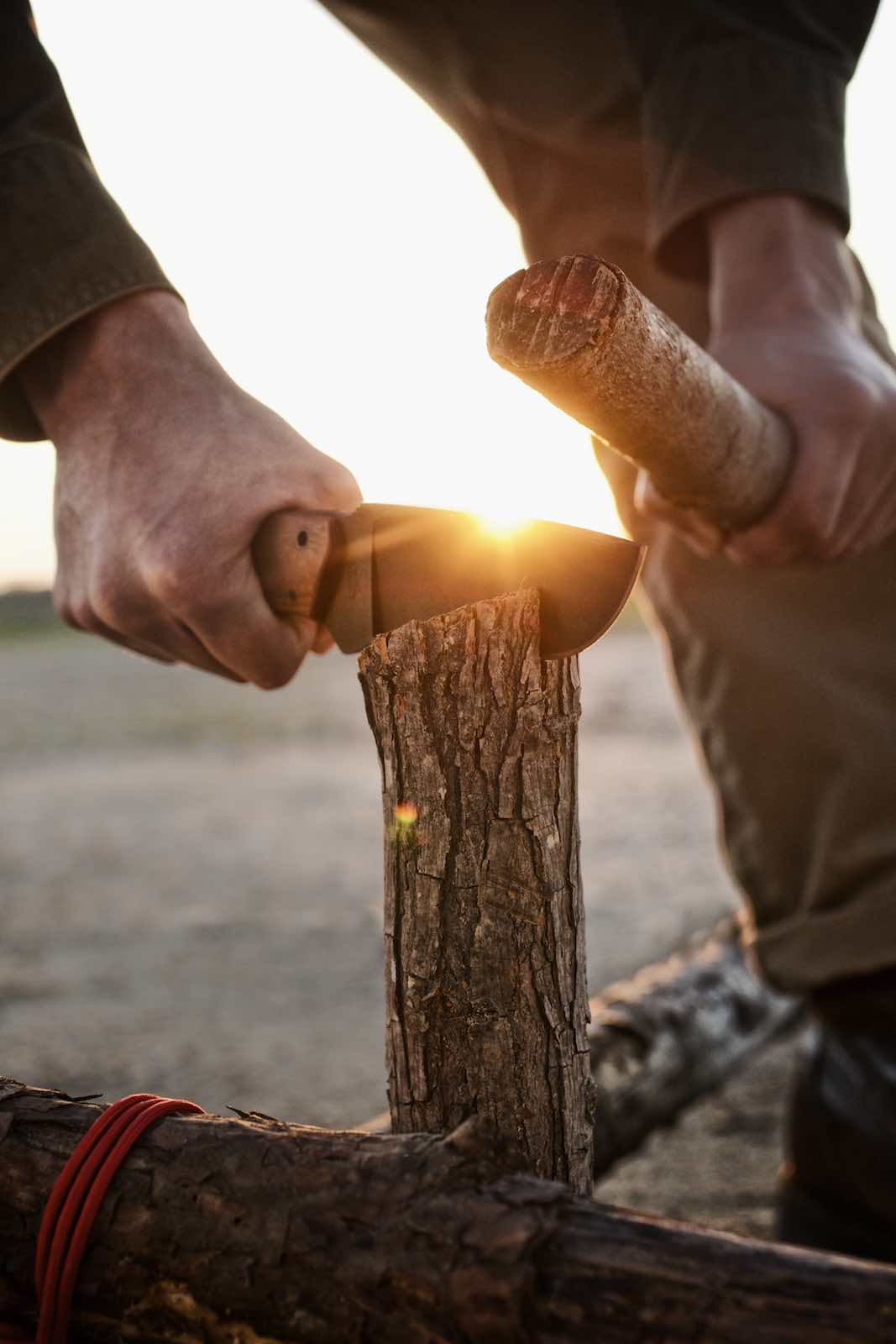 Jody Horton Photography - Sunlit, large knife being used to split wood. 