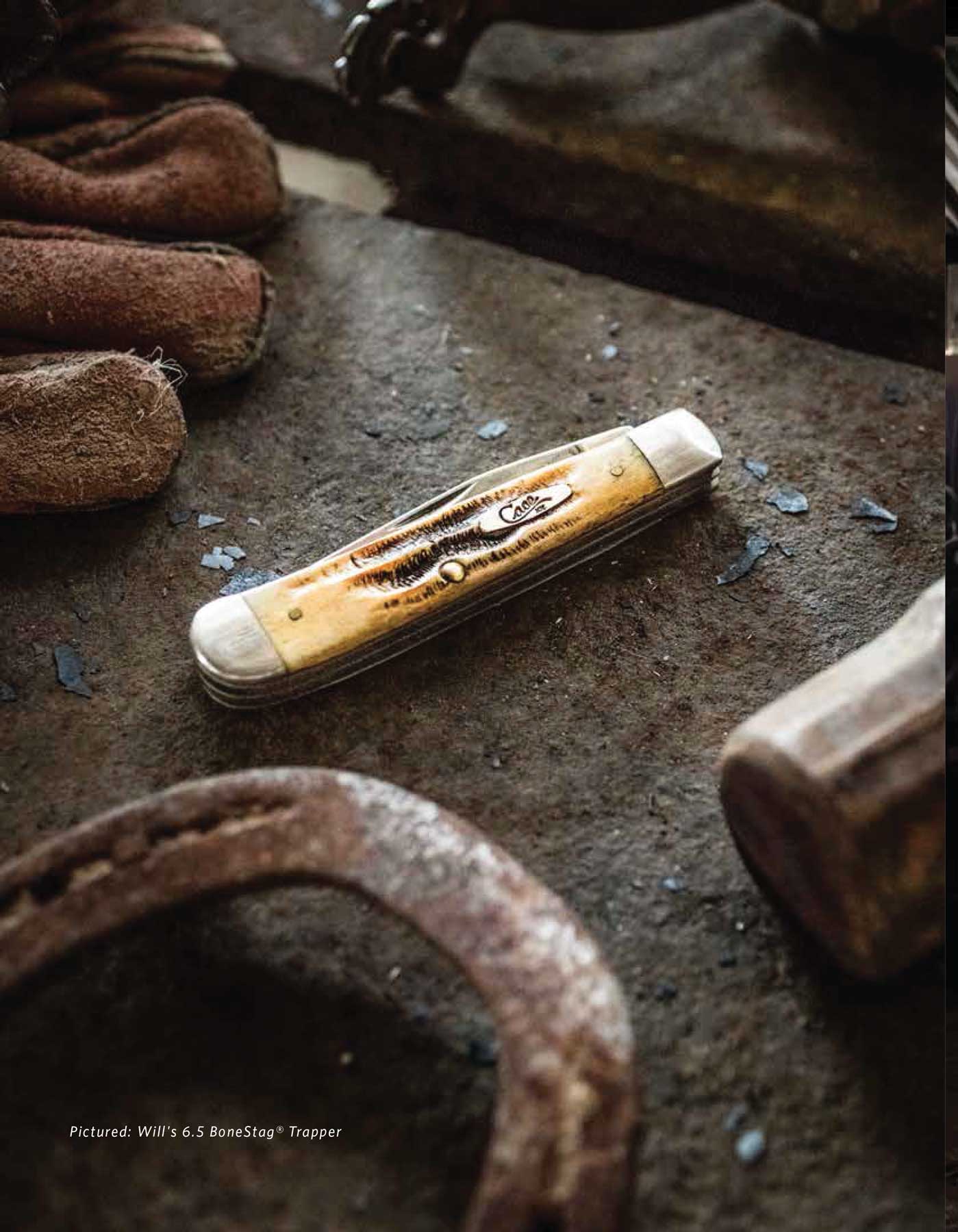 Jody Horton Photography - Closed pocket knife with a yellow bone casing on a work table. 