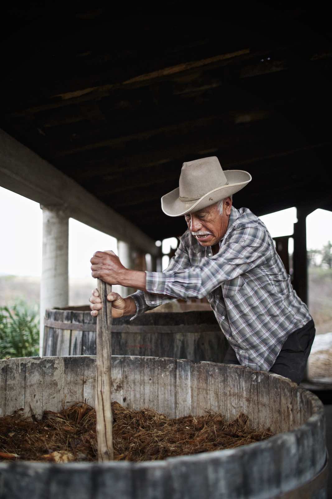 Jody Horton Photography - Farmer mixing agave fibers. 