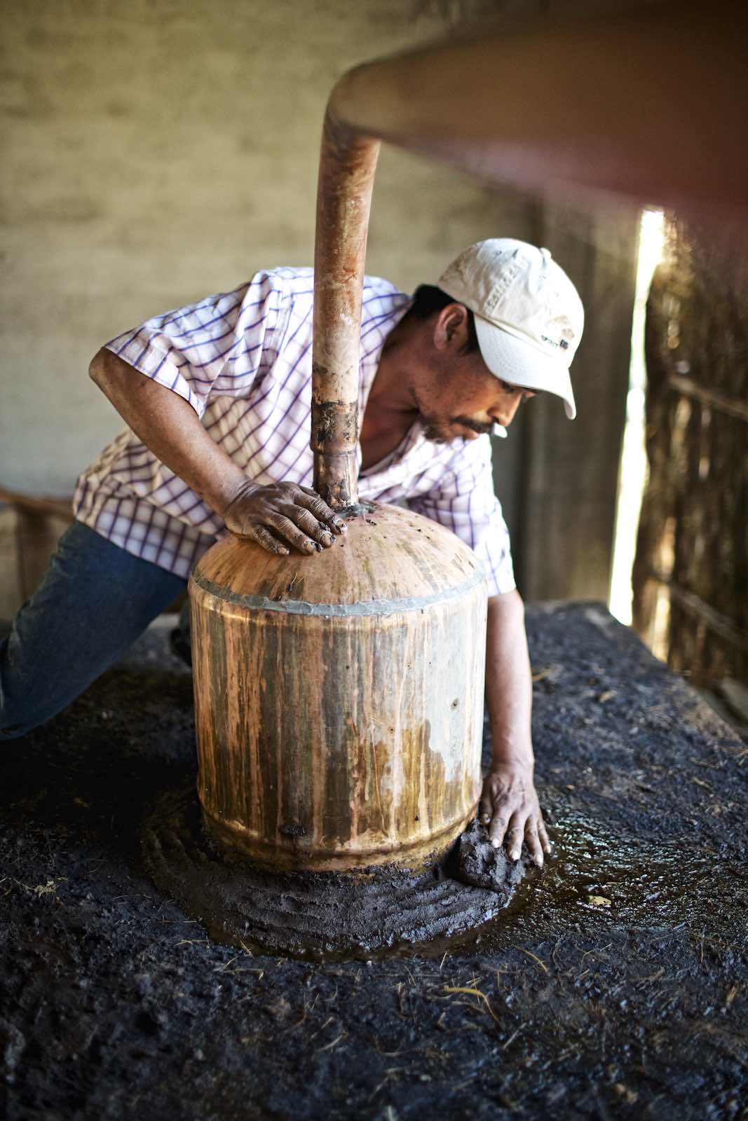 Jody Horton Photography - Worker securing vats with mud.