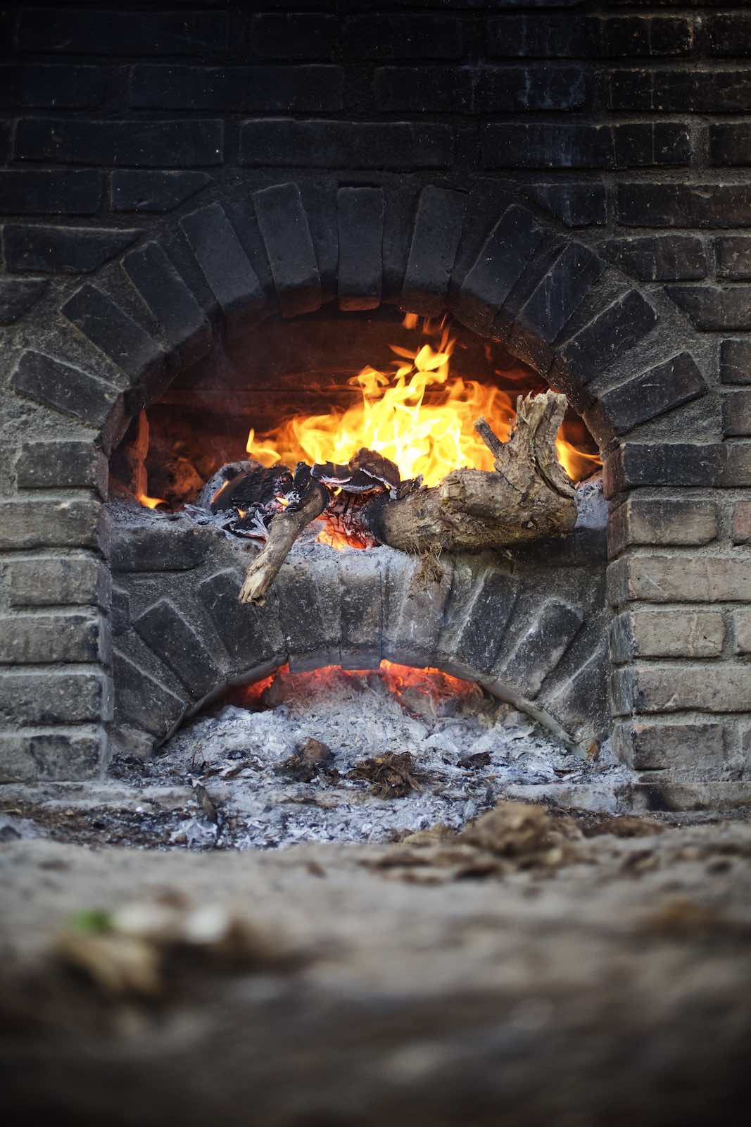 Jody Horton Photography - Wood fire during mezcal production. 
