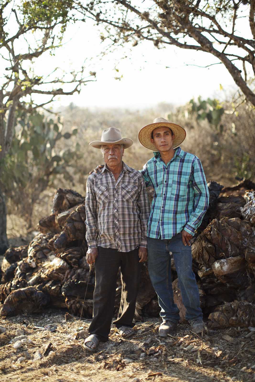 Jody Horton Photography - Two farmers during mezcal production.