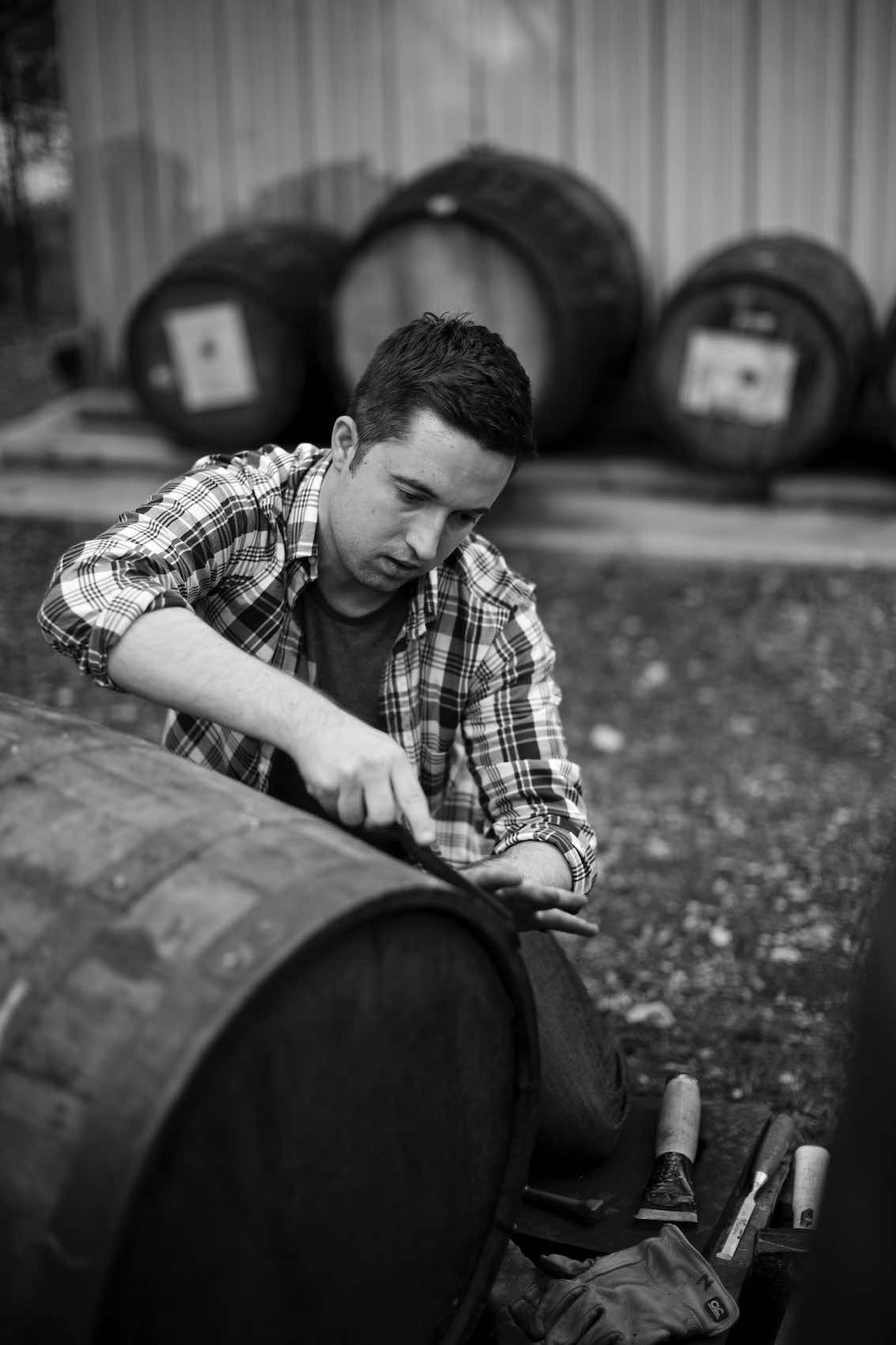 Jody Horton Photography - Worker crafting a wood barrel, shot in B&W. 