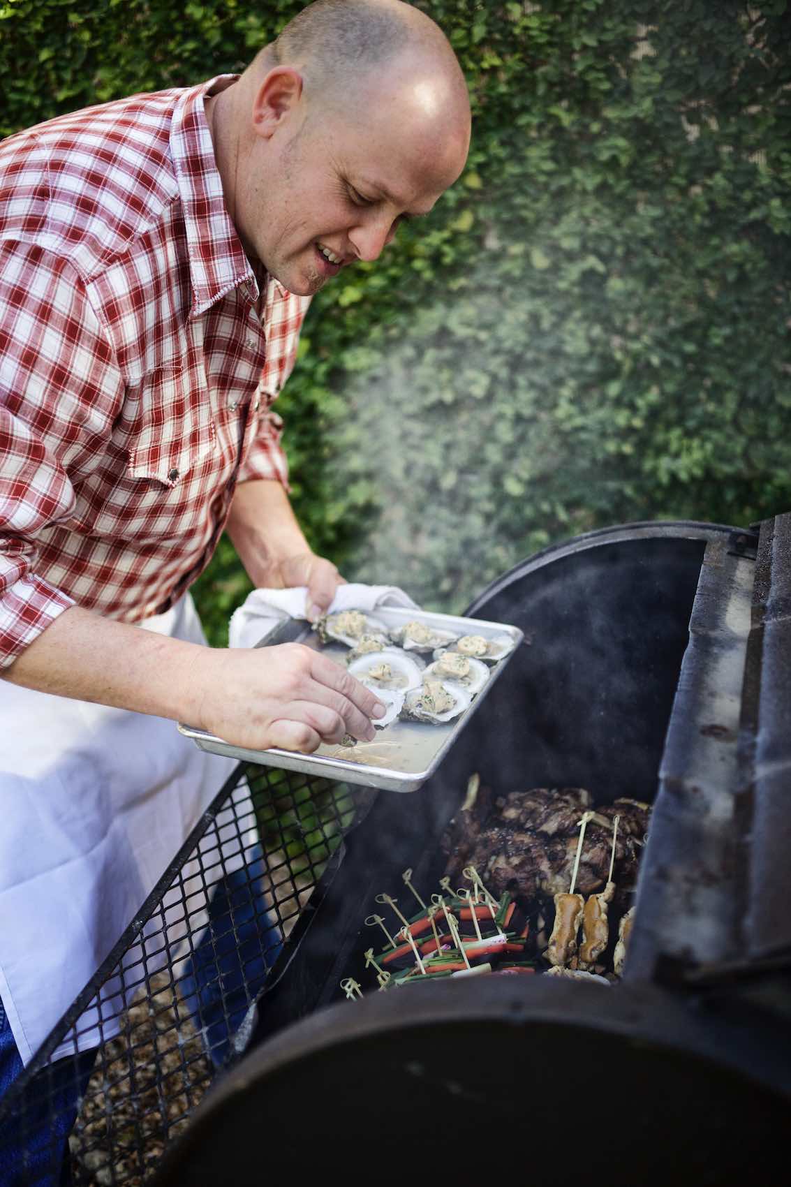 Jody Horton Photography - Chef preparing oysters on outdoor grill.