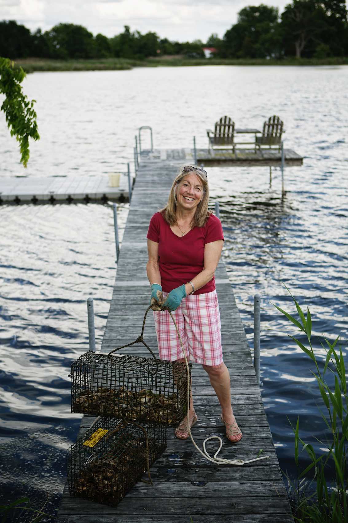 Jody Horton Photography - Fisherwoman hauling catch from a lake. 