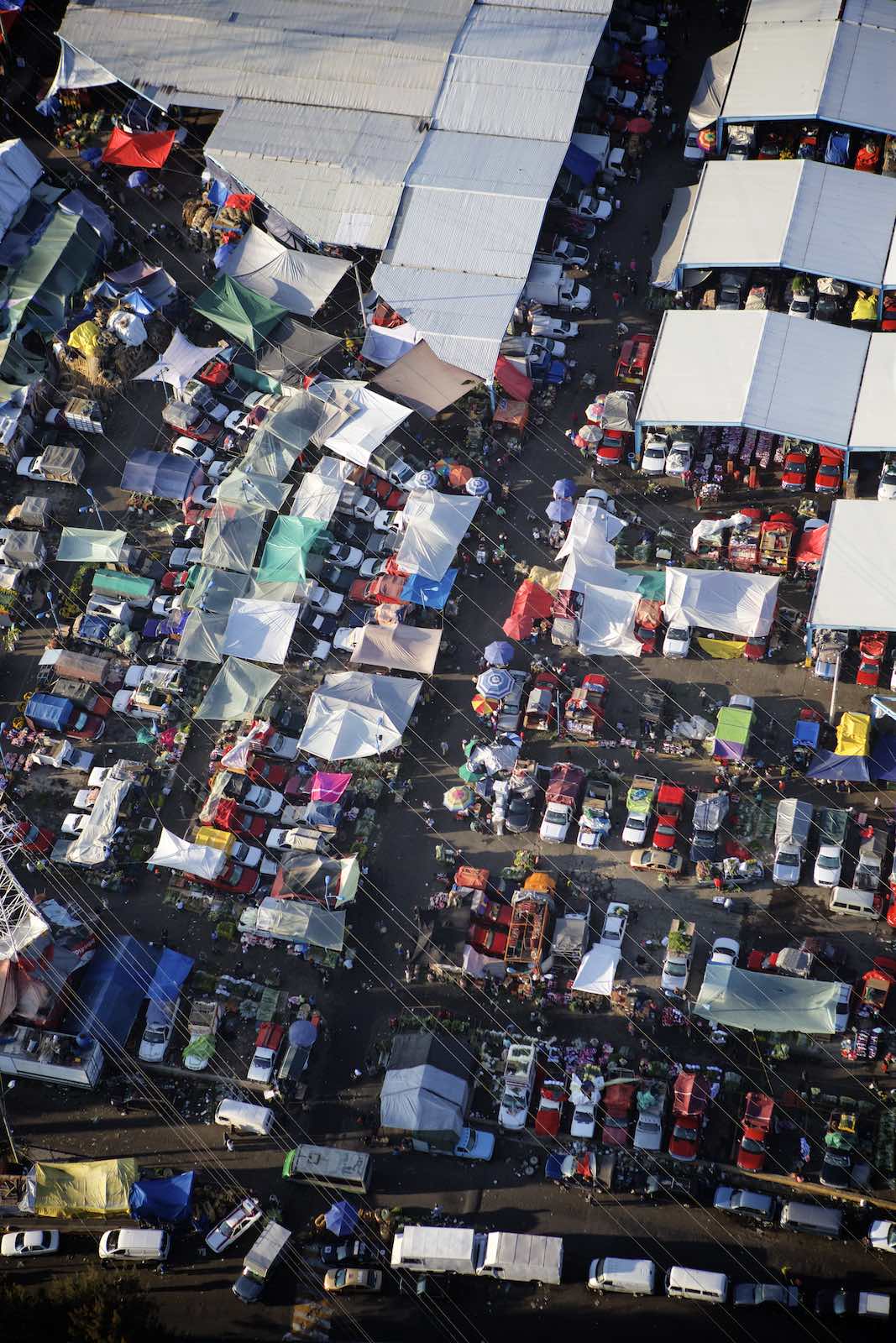 Jody Horton Photography - The colorful tops of shops and cars in the food market. 