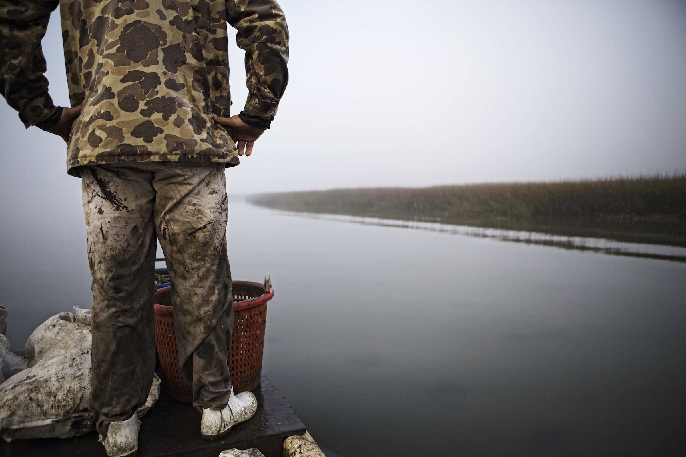 Jody Horton Photography - Fisherman standing at the boat