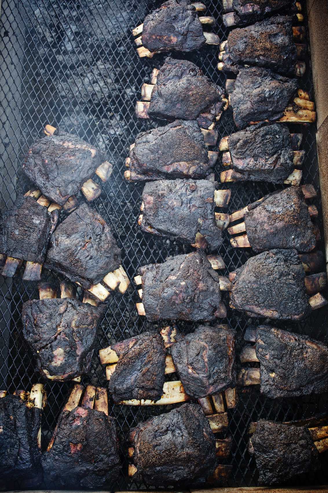 Jody Horton Photography - Blackened ribs cooking on grill grate.