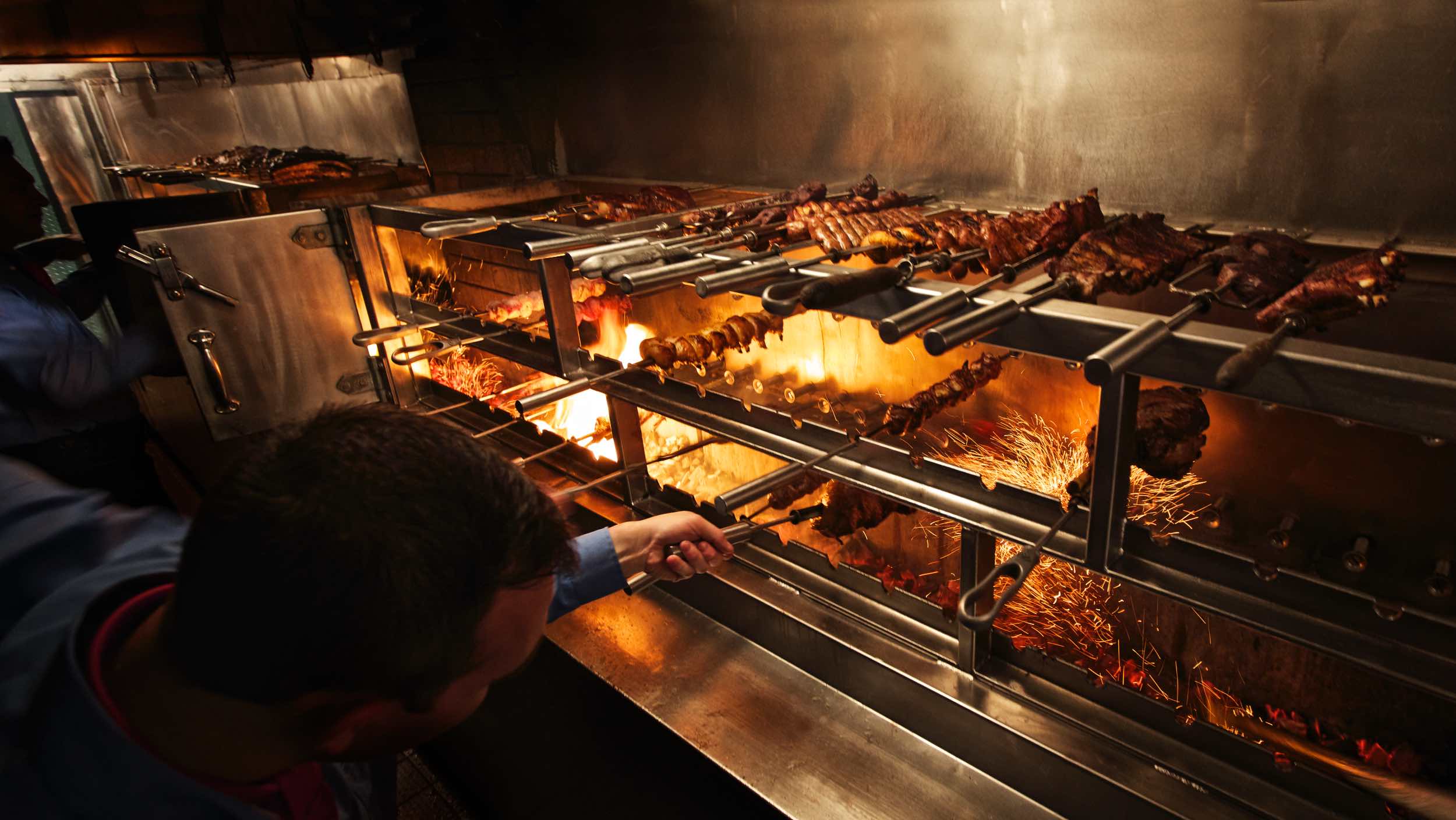 Jody Horton Photography - Chefs cooking skewered meats on the line.