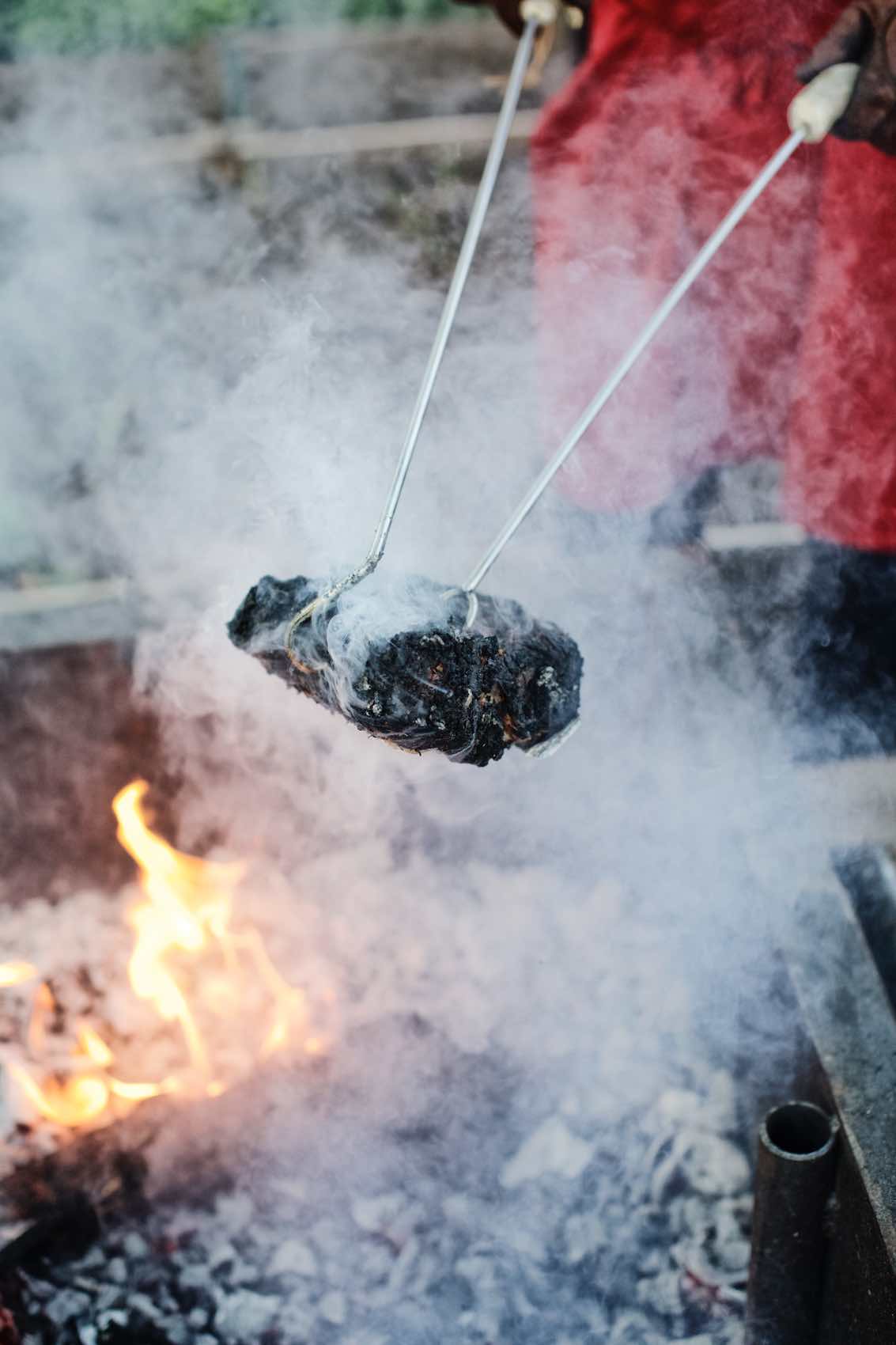 Jody Horton Photography - Blackened meat pulled from fire. 