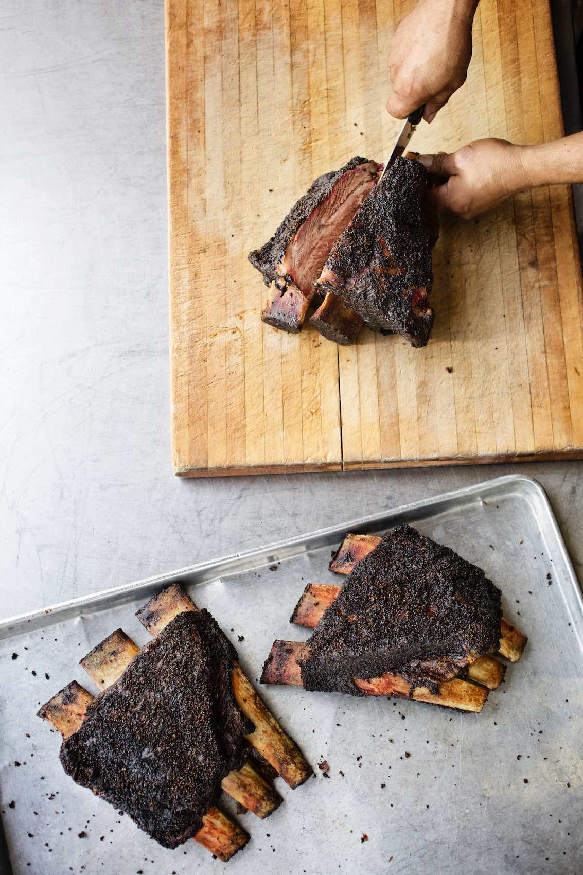 Jody Horton Photography - Blackened ribs sliced on wood cutting board. 