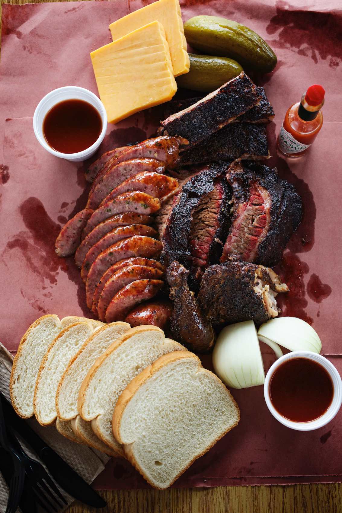 Jody Horton Photography - Barbecue spread on parchment with Tabasco hot sauce. 