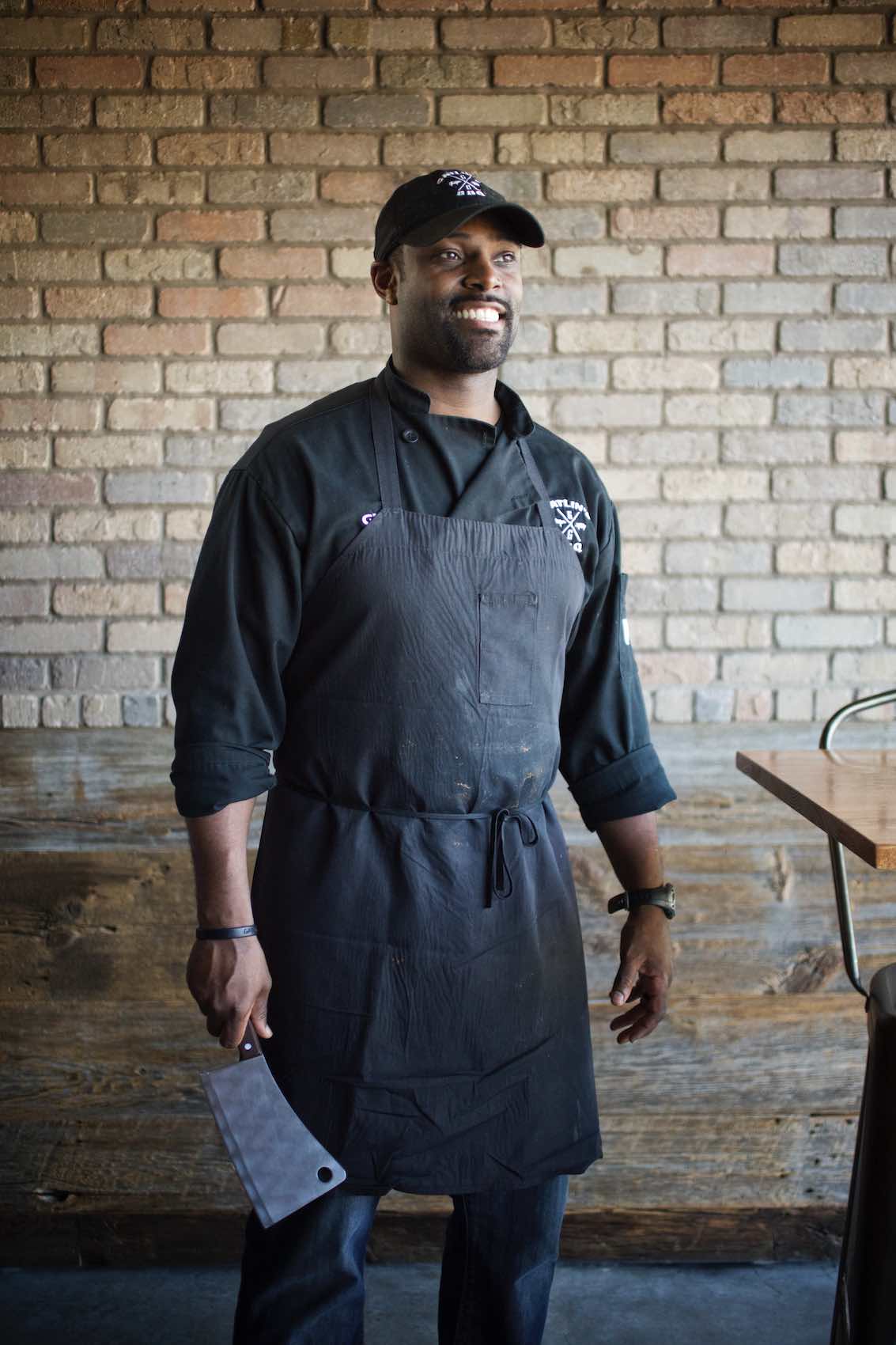 Jody Horton Photography - Chef in uniform holding a butcher