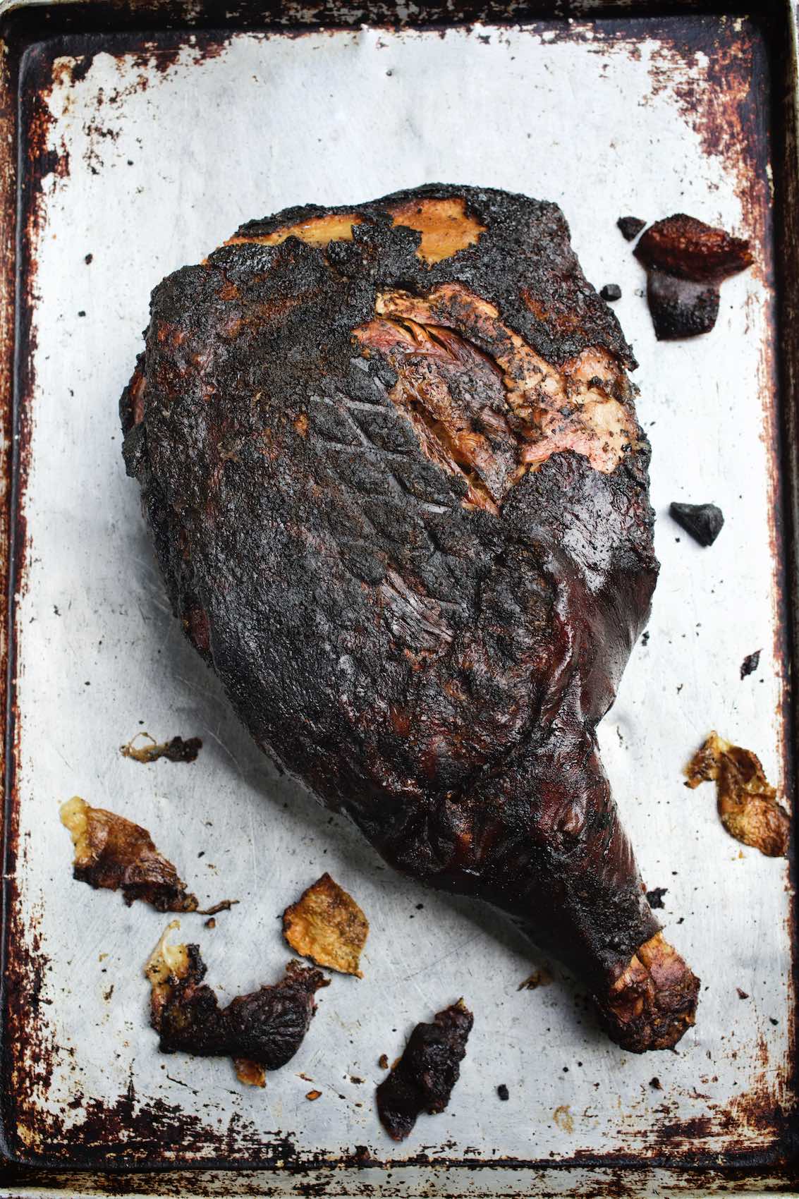 Jody Horton Photography - Blackened, barbecued meat on metal sheet pan. 