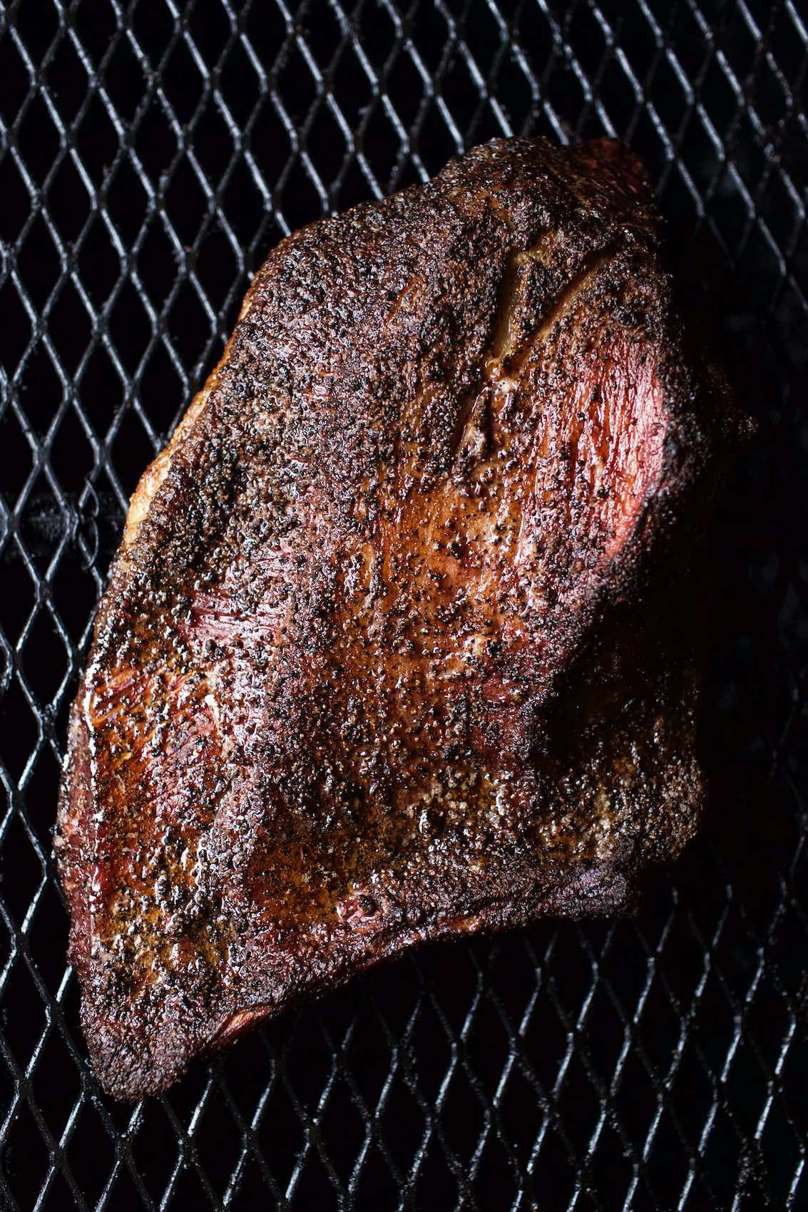 Jody Horton Photography - Smoked meat on grill grate. 