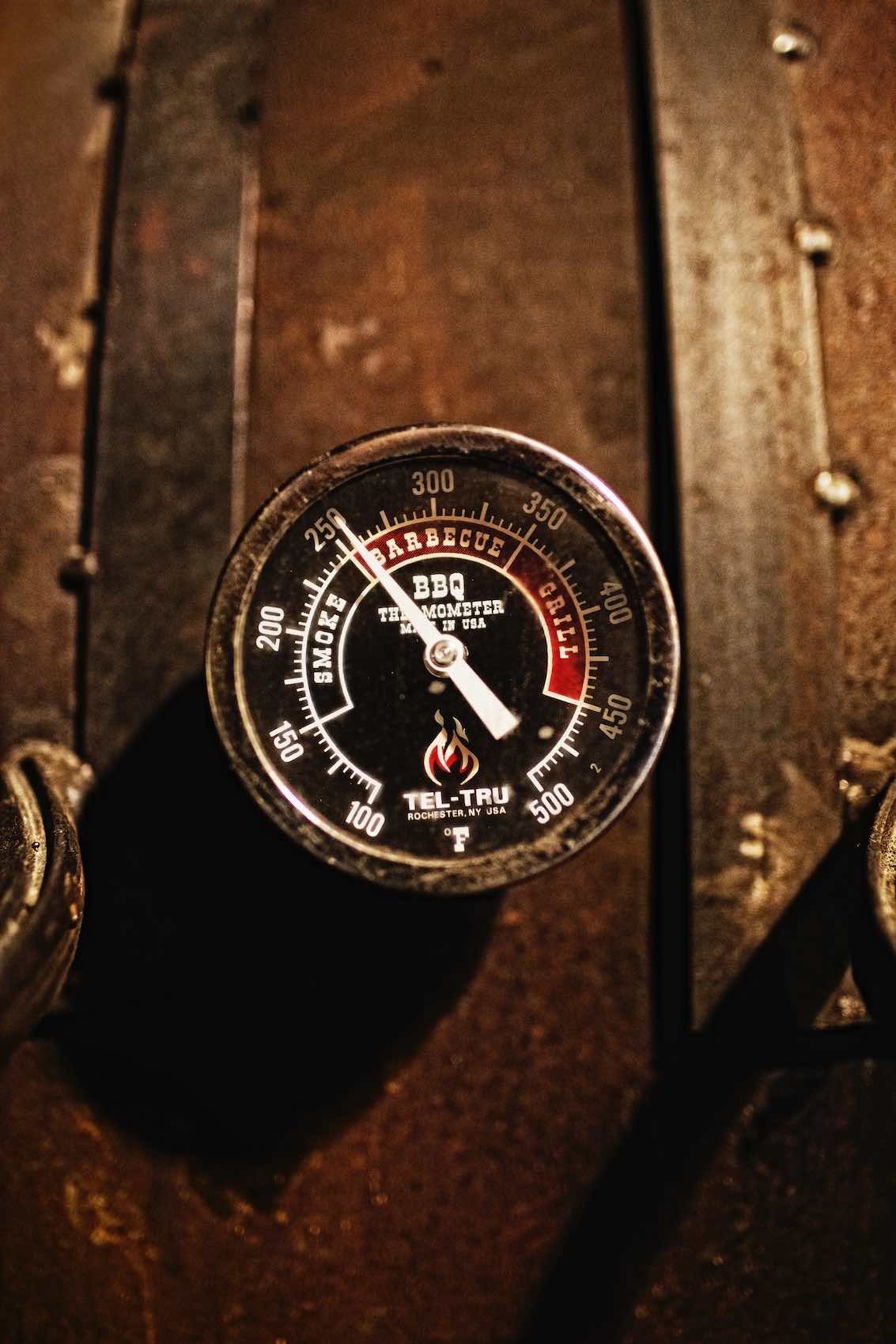 Jody Horton Photography -  Barbecue thermometer outside smoker. 
