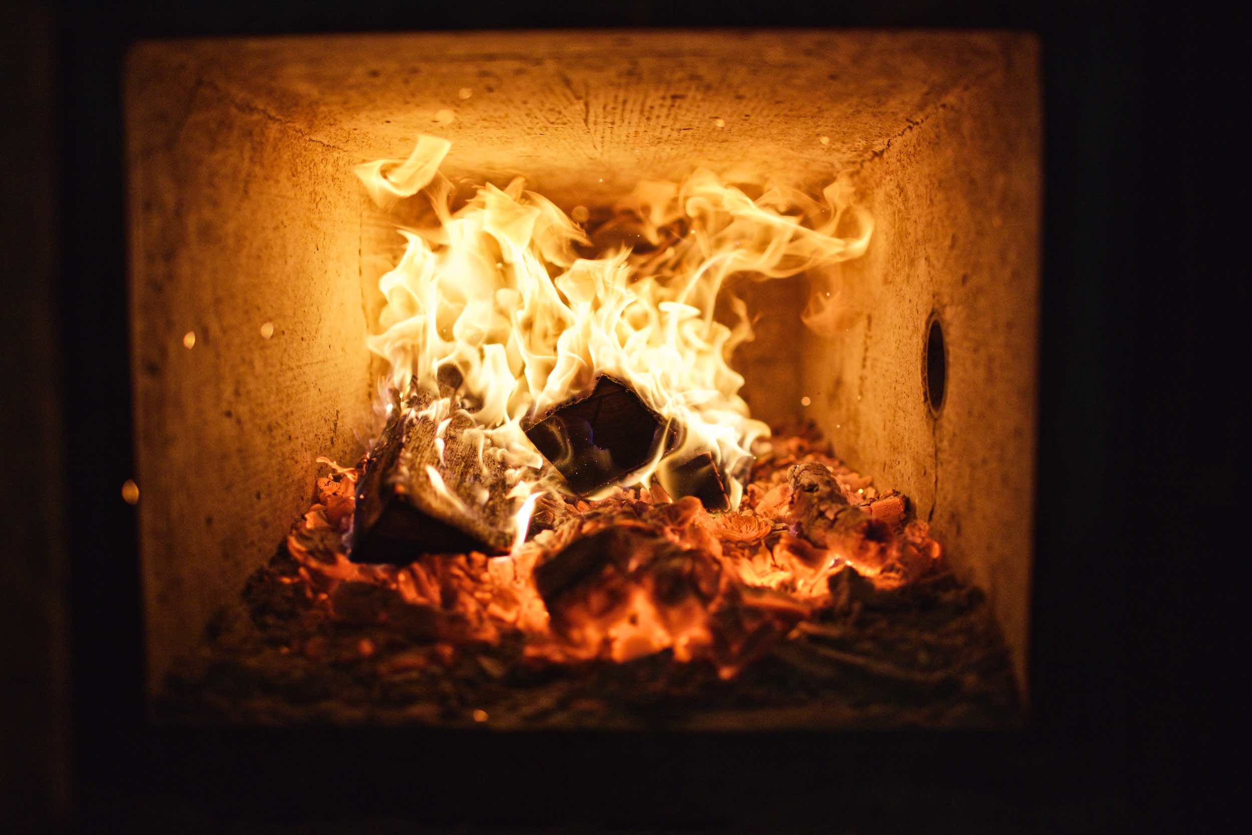 Jody Horton Photography - Charcoal and wood fire inside smoker. 