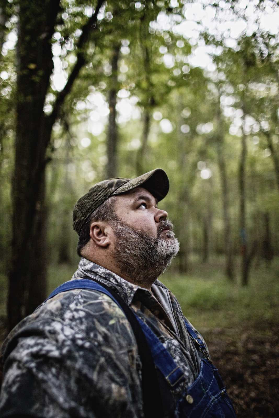Jody Horton Photography - Hunter looking up into trees. 